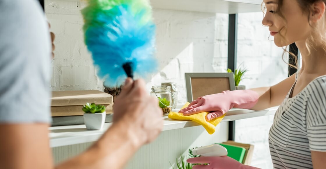 Young couple doing spring-cleaning together