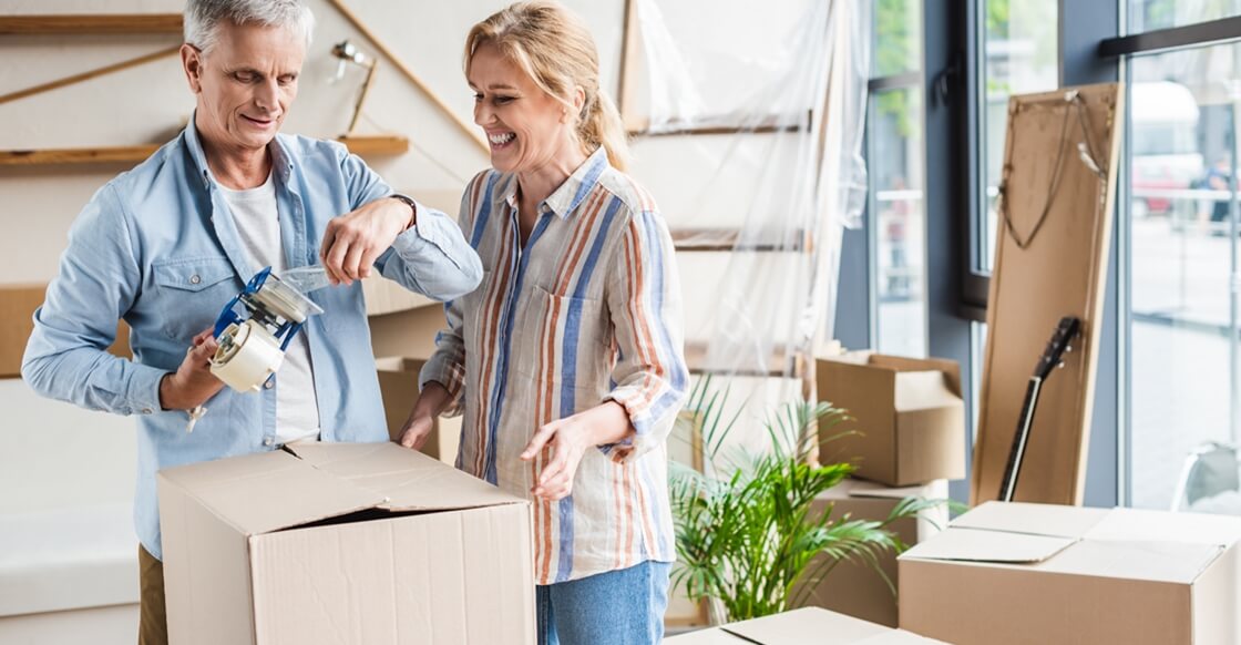 Couple packing items for self storage.