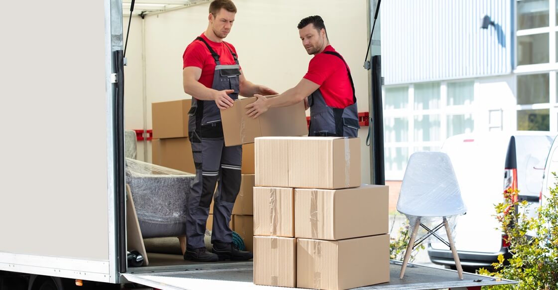 Professional movers loading truck